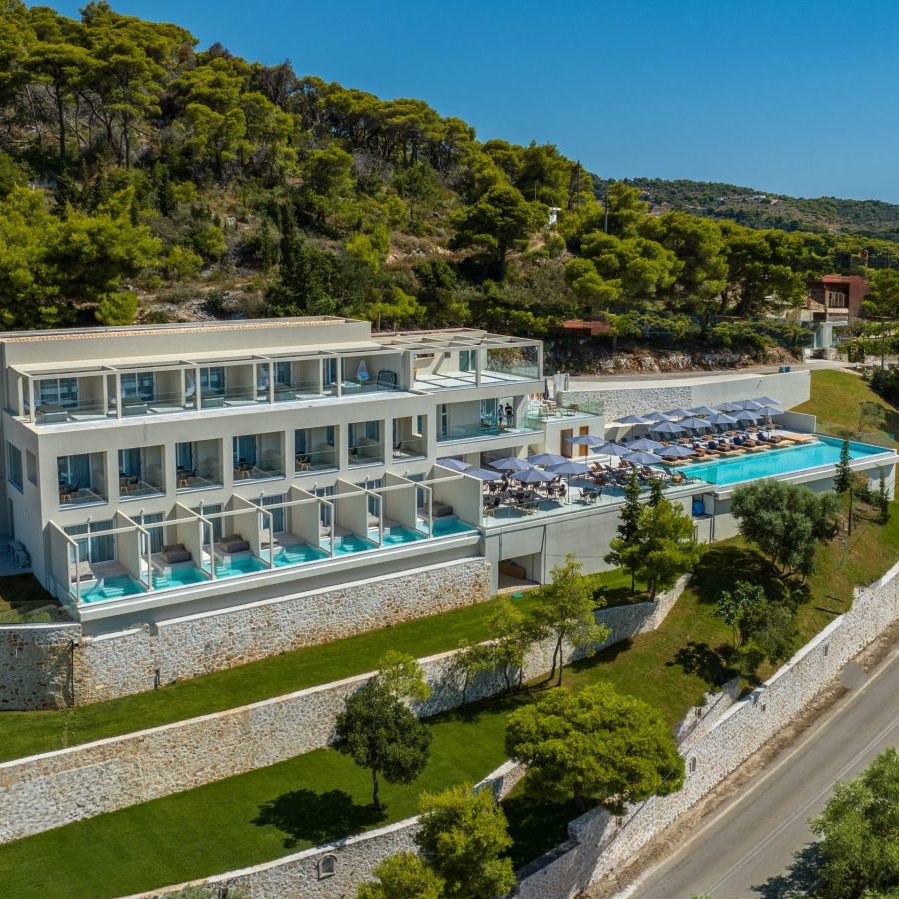 dr6 sqr Outdoor swimming pool with relaxation deck and premium sunbeds, Myzith Luxury Suites, Keri, Zakynthos, Greece.