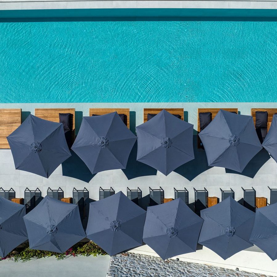 dr4 sqr Outdoor swimming pool with relaxation deck and premium sunbeds, Myzith Luxury Suites, Keri, Zakynthos, Greece.