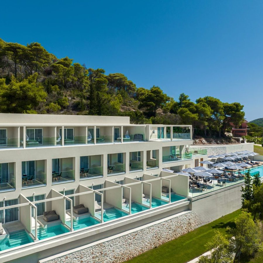 dr3 sqr Outdoor swimming pool with relaxation deck and premium sunbeds, Myzith Luxury Suites, Keri, Zakynthos, Greece.