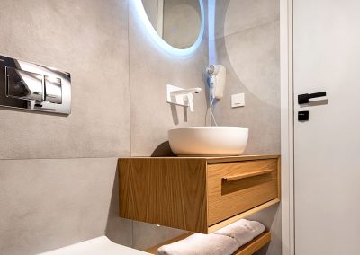 Bright suite bedroom with crisp linens and contemporary minimal design, Myzith Luxury Suites, Keri, Zakynthos, Greece.