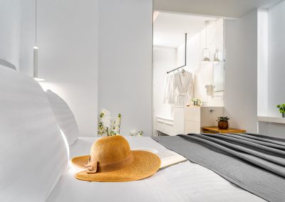 Suite bed close-up with luxury linens and relaxing ambiance, Myzith Luxury Suites, Keri, Zakynthos, Greece.