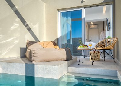 Private balcony with outdoor chairs and scenic Zakynthos landscape view, Myzith Luxury Suites, Keri, Zakynthos, Greece.